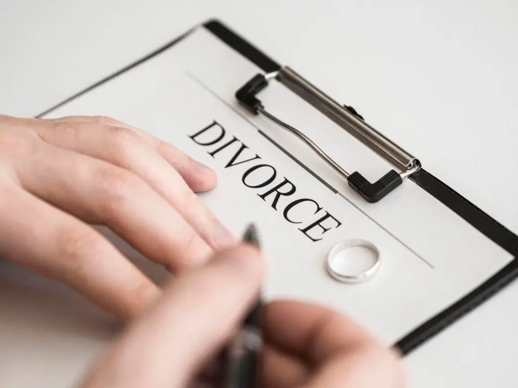 close-up-male-signing-divorce-contract_23-2148536076
